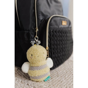 Bumble the Bee keychain clipped to a nappy bag