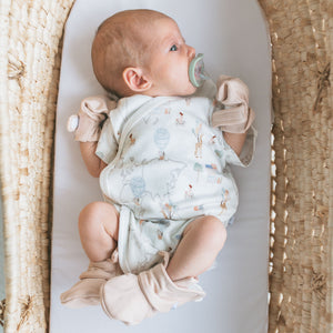 Baby wearing Kays+Kins Nomadic Sand mitts and booties