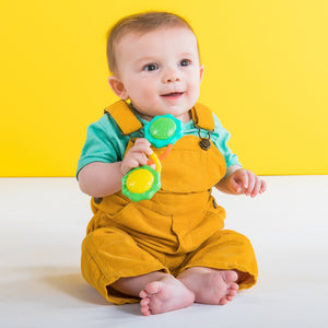 Baby shaking the Bright Starts Rattle & Shake Barbell
