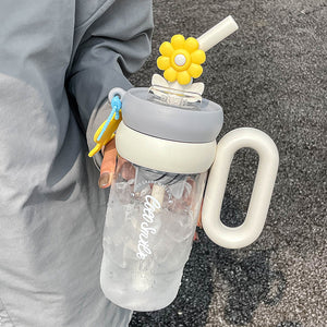 COCO SMILE 1000ml Flower Twirling Cup White carried by the handle